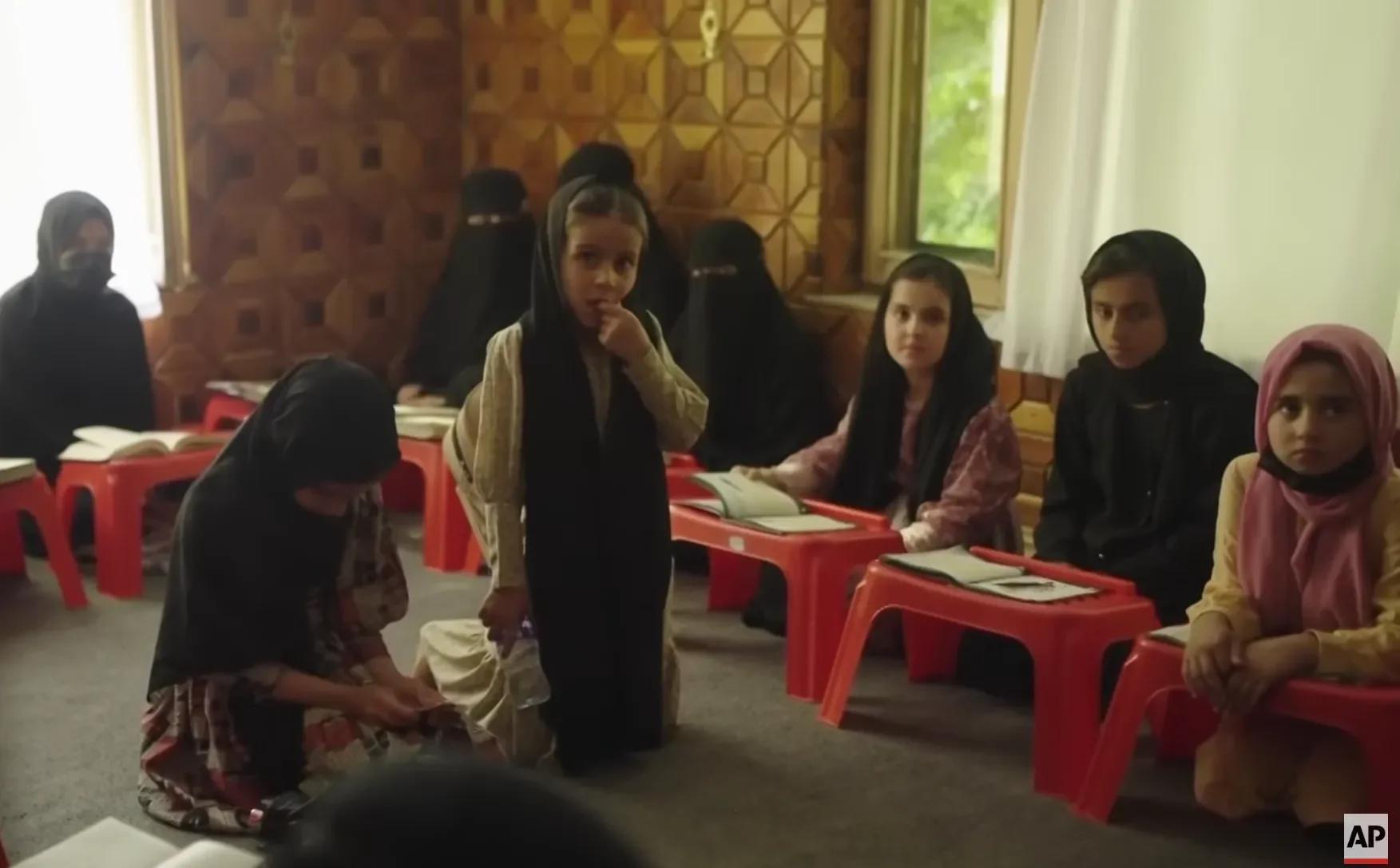 Afghan girls attending a religious school. 